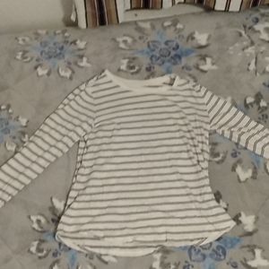 White and black striped long sleeved women's top.